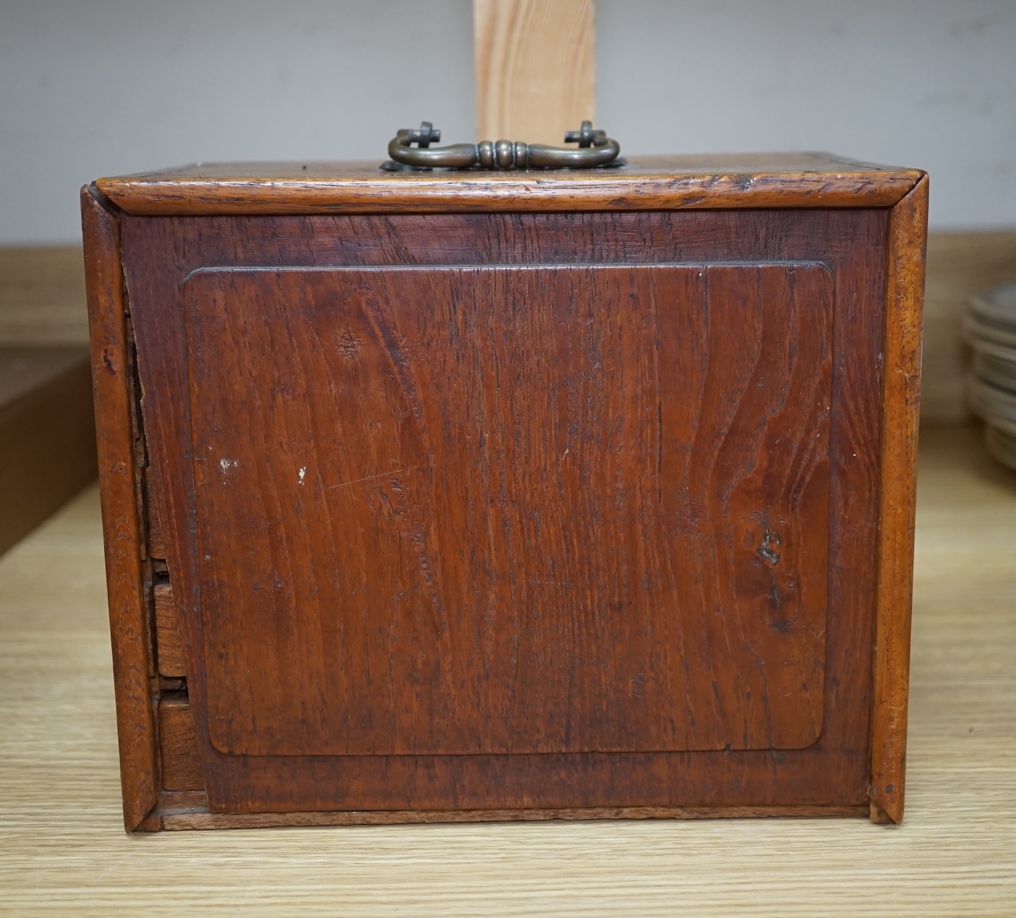 A Chinese boxed bone Mah jong set with five drawers, 19cm high. Condition - poor to fair, case damaged